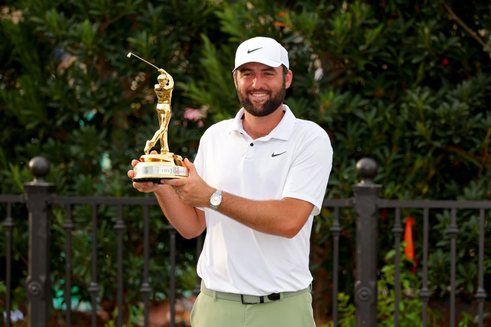 Scottie Scheffler celebrates with the trophy after winning during the final round of THE PLAYERS Championship at TPC Sawgrass on March 17, 2024 in Ponte Vedra Beach, Florida.