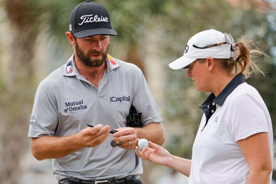 Cameron Young (left) checks balls with his teammate Lauren Caughlin on the first tee during the second round of the Grant Thornton Invitational at Tiburon Golf Club.