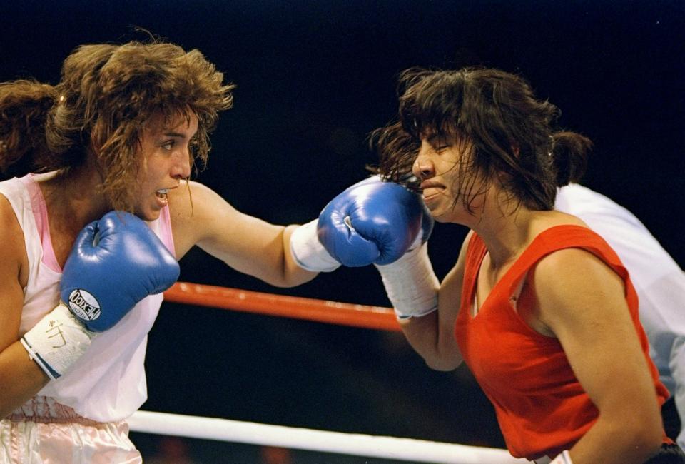 7 May 1994:  Christy Martin, left, and Laura Serrano Garcia trade blows during a bout in Las Vegas, Nevada.  Martin won the fight with a decision in the sixth round. Mandatory Credit: Al Bello  /Allsport