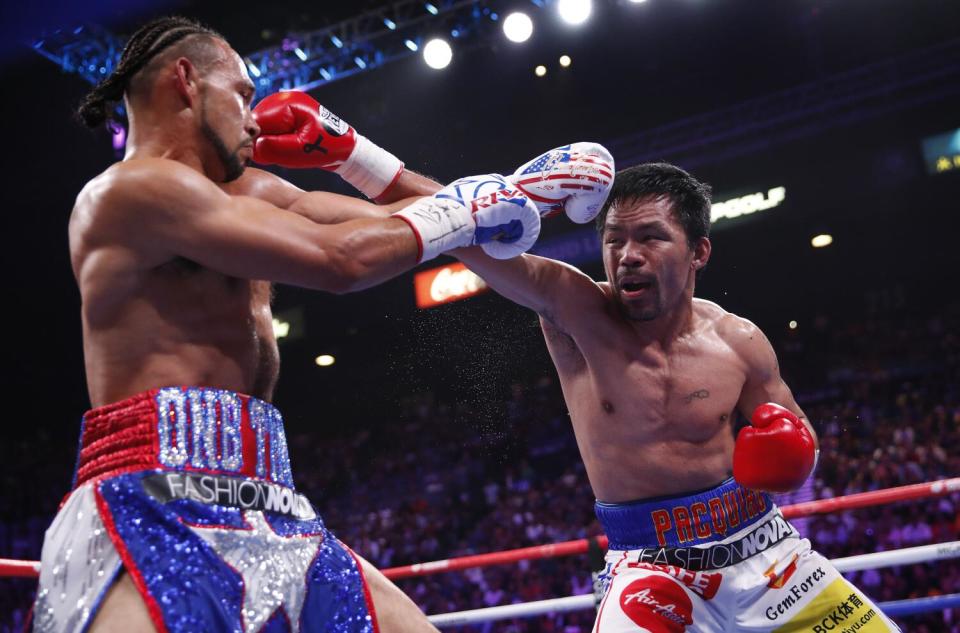 Manny Pacquiao, right, throws a punch at Keith Thurman during their welterweight fight in Las Vegas in July 2019.