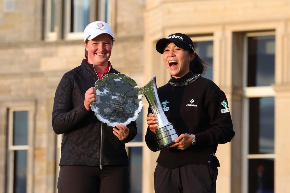 Lottie Woad of England, The Leading Amateur, and Lydia Ko of New Zealand pose for a photo on Day Four of the AIG Women's Open at St Andrews Old Course on August 25, 2024 in St Andrews, Scotland. (Photo by Michael Reaves/Getty Images)