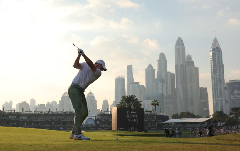 Rory McIlroy plays his second shot into the 18th green during the final round of the Hero Dubai Desert Classic 2024 at Emirates Golf Club in Dubai, United Arab Emirates.