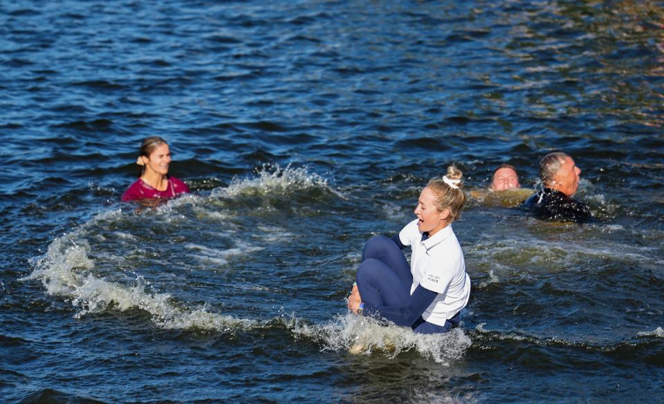 Nelly Korda jumps in the lake after winning the 2024 Chevron Championship.