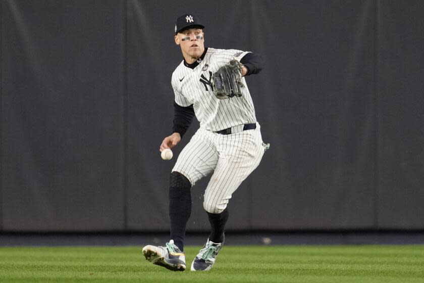 New York Yankees center fielder Aaron Judge makes a fielding error during the fifth inning of Game 5 of the