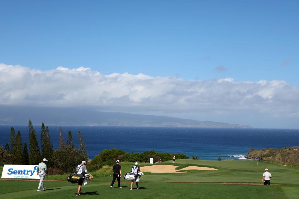 Cameron Young, Xander Schauffele and Patrick Cantlay walk the 11th hole during the third round of The Sentry 2024 at Plantation Course at Kapalua Golf Club in Kapalua, Hawaii