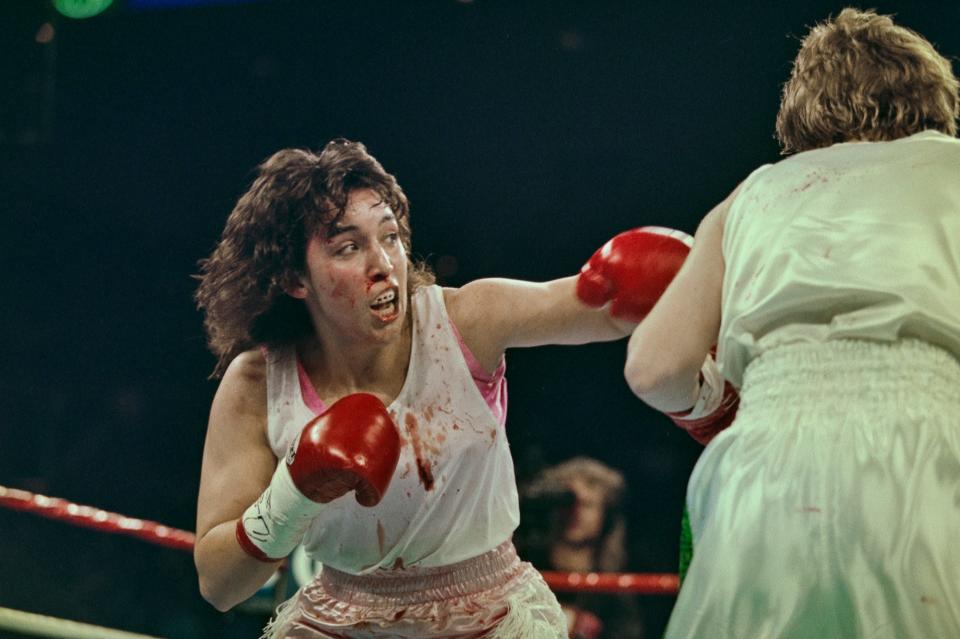 Boxer Christy Martin from the United States (left) throws a punch at Deirdre Gogarty of Ireland during their WBC Championship Boxing Lightweight fight on 16th March 1996 at the MGM Grand Garden Arena in Paradise, Nevada, United States. Martin wins by Unanimous Decision.   (Photo by Al Bello/Allsport//Getty Images)