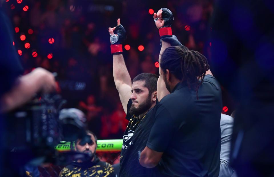 Jan 18, 2025; Inglewood, California, USA; Islam Makhachev (red gloves) reacts after defeating Renato Moicano (not pictured) in a lightweight title fight during UFC 311 at Intuit Dome. Mandatory Credit: Gary A. Vasquez-Imagn Images