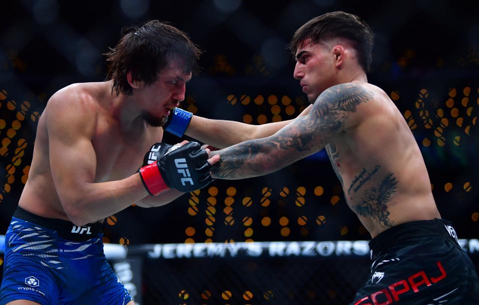 Jan 18, 2025; Inglewood, California, USA; Ricky Turcios (red gloves) fights Benardo Sopaj (blue gloves) during UFC 311 at Intuit Dome. Mandatory Credit: Gary A. Vasquez-Imagn Images