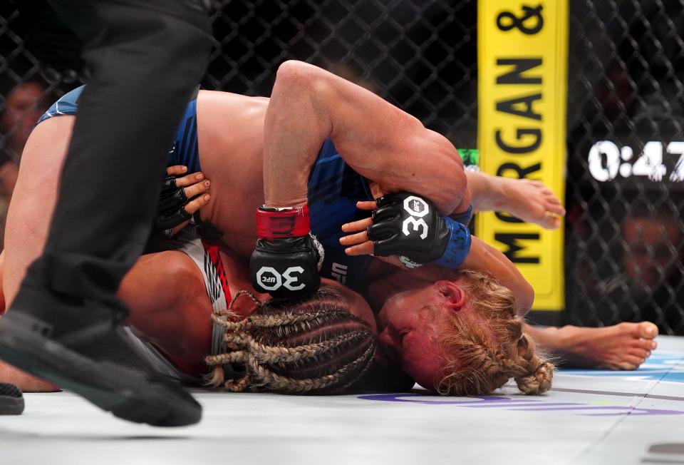 Mar 25, 2023; San Antonio, Texas, USA; Holly Holm (red gloves) fights Yana Santos (blue gloves) during UFC Fight Night at AT&T Center. Mandatory Credit: Aaron Meullion-USA TODAY Sports