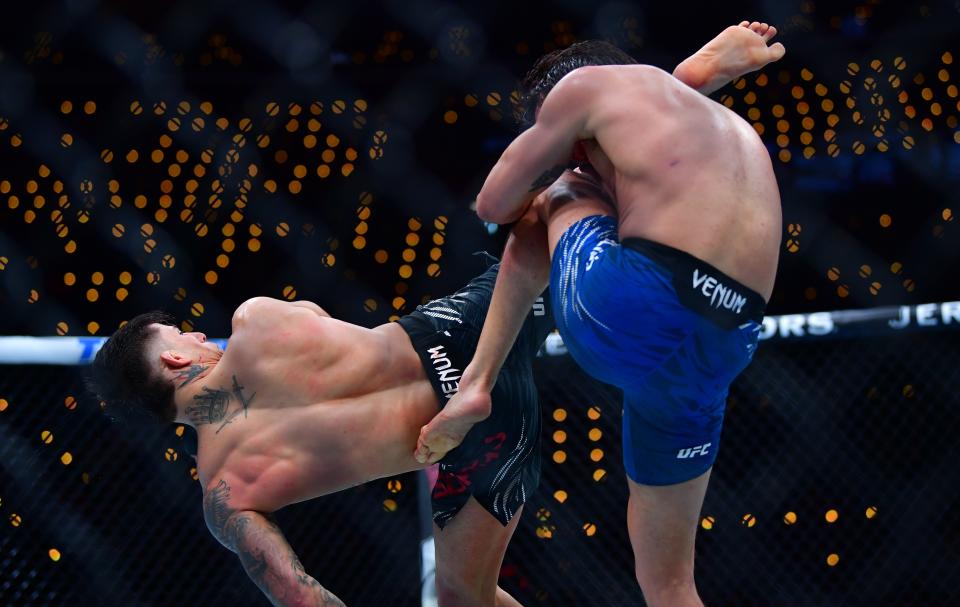 Jan 18, 2025; Inglewood, California, USA; Ricky Turcios (red gloves) fights Benardo Sopaj (blue gloves) during UFC 311 at Intuit Dome. Mandatory Credit: Gary A. Vasquez-Imagn Images