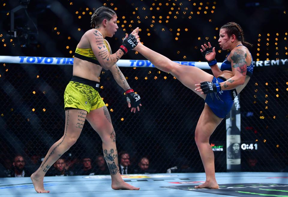 Jan 18, 2025; Inglewood, California, USA; Karol Rosa (red gloves) fights Ailin Perez (blue gloves) during UFC 311 at Intuit Dome. Mandatory Credit: Gary A. Vasquez-Imagn Images