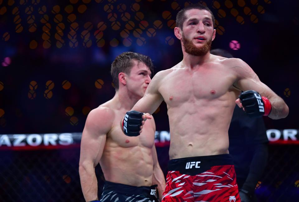 Jan 18, 2025; Inglewood, California, USA; Tagir Ulanbekov (red gloves) celebrates after defeating Clayton Carpenter (blue gloves) during UFC 311 at Intuit Dome. Mandatory Credit: Gary A. Vasquez-Imagn Images