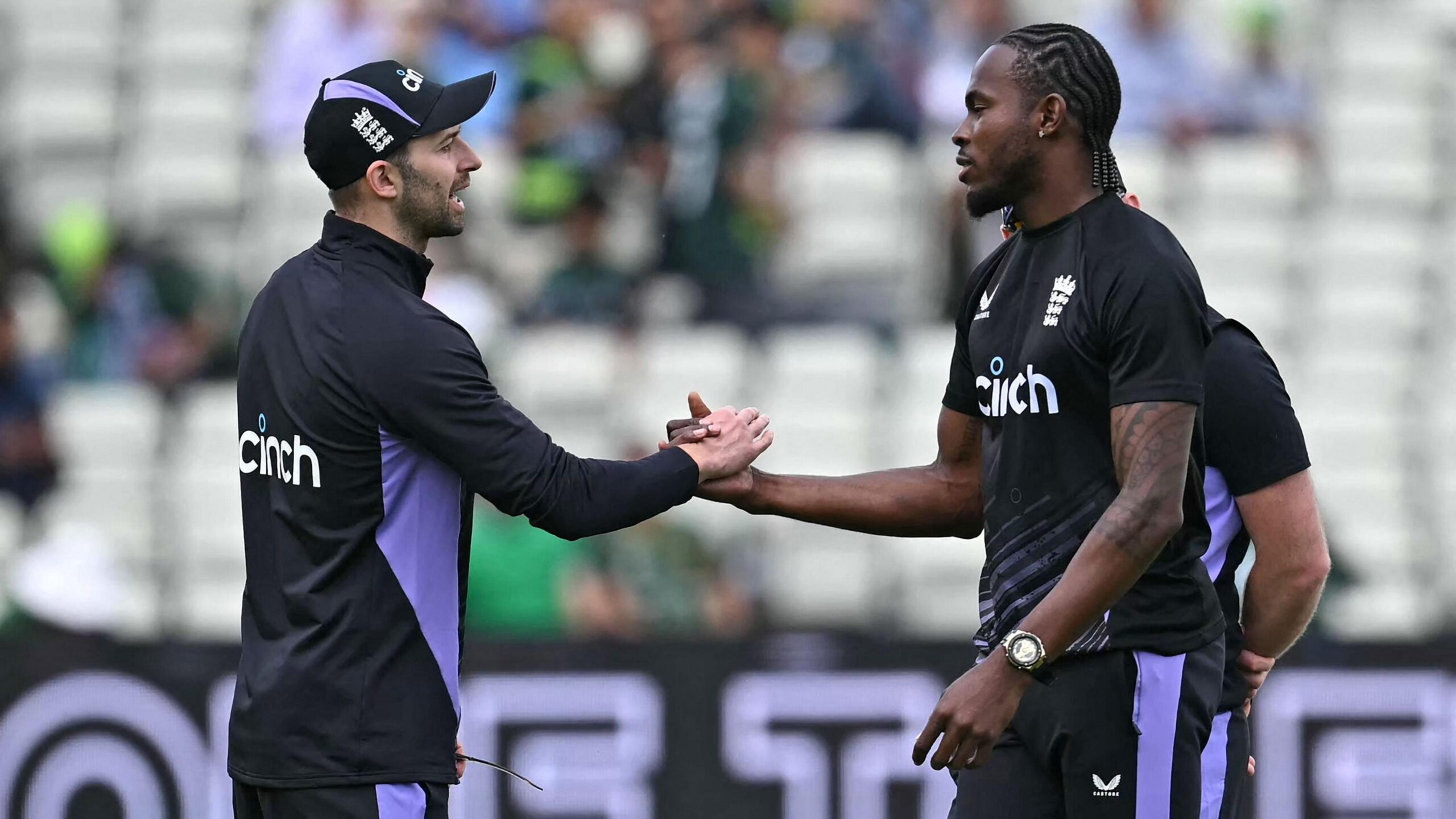 England fast bowlers Mark Wood (left) and Jofra Archer (right) shake hands during a warm-up before a T20 international