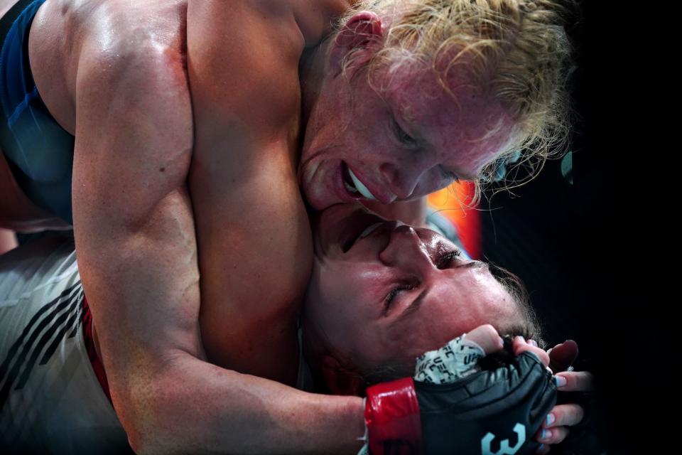 Mar 25, 2023; San Antonio, Texas, USA; Holly Holm (red gloves) fights Yana Santos (blue gloves) during UFC Fight Night at AT&T Center. Mandatory Credit: Aaron Meullion-USA TODAY Sports