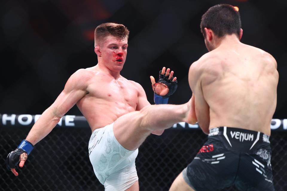 Mar 30, 2024; Atlantic City, New Jersey, USA; Angel Pacheco (red gloves) fights Caolan Loughran (blue gloves) during UFC Fight Night at Boardwalk Hall. Mandatory Credit: Ed Mulholland-USA TODAY Sports