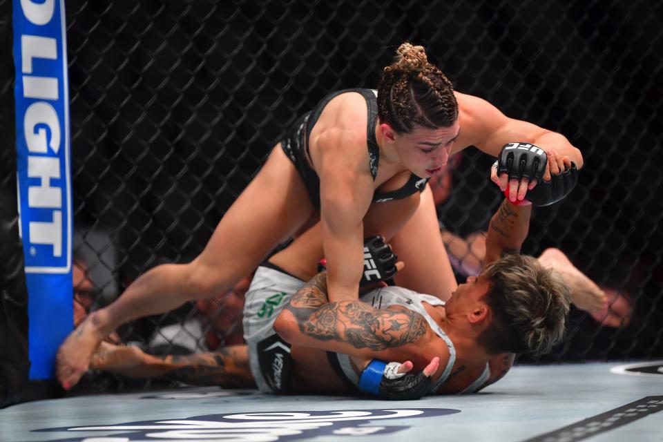 Feb 17, 2024; Anaheim, California, USA; Mackenzie Dern pins Amanda Lemos to the mat during UFC 298 at Honda Center. Mandatory Credit: Gary A. Vasquez-USA TODAY Sports