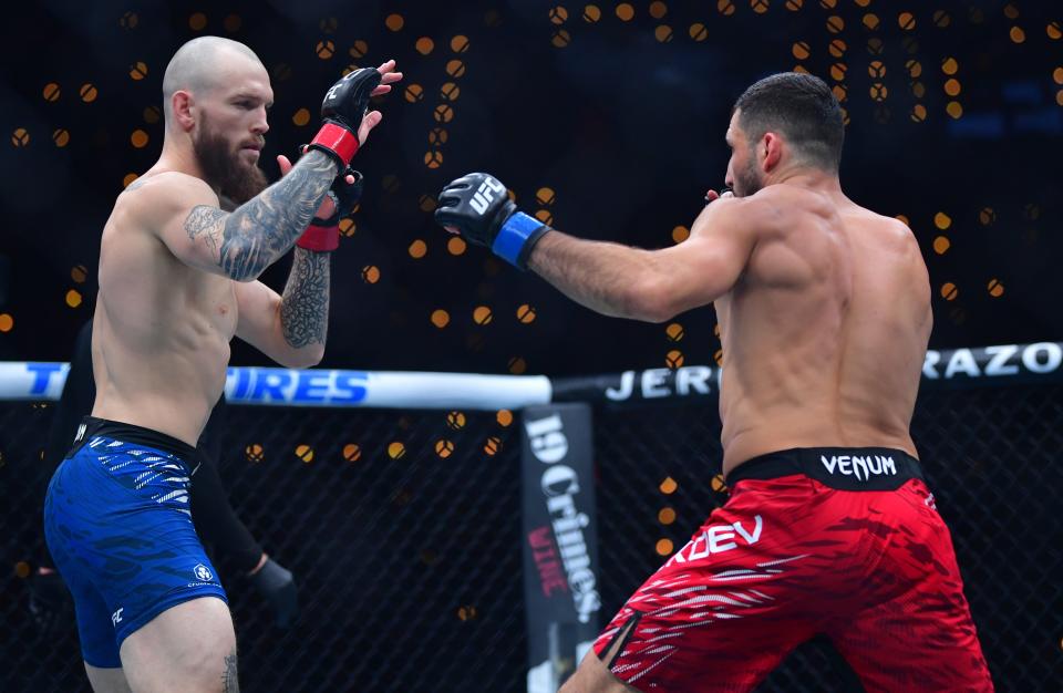 Jan 18, 2025; Inglewood, California, USA; Zachary Reese (red gloves) fights Azamat Bekoev (blue gloves) during UFC 311 at Intuit Dome. Mandatory Credit: Gary A. Vasquez-Imagn Images