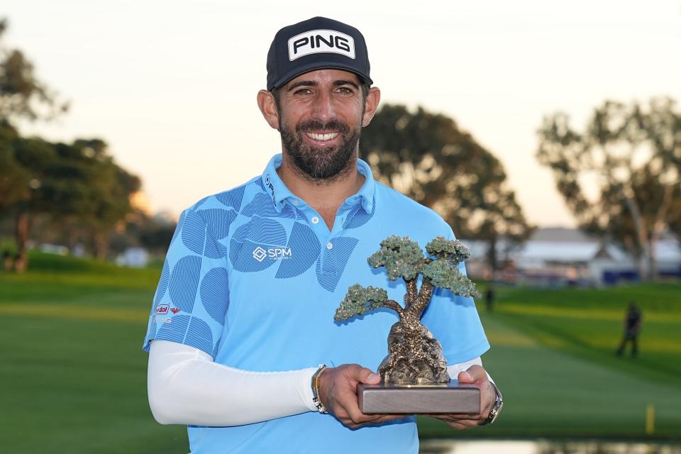 Jan 27, 2024; San Diego, California, USA; Matthieu Pavon with his championship trophy after the final round of the Farmers Insurance Open golf tournament at Torrey Pines Municipal Golf Course - South Course. Mandatory Credit: Ray Acevedo-USA TODAY Sports