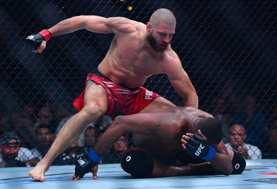 Jan 18, 2025; Inglewood, California, USA; Jiri Prochazka (red gloves) fights Jamahal Hill (blue gloves) during UFC 311 at Intuit Dome. Mandatory Credit: Gary A. Vasquez-Imagn Images