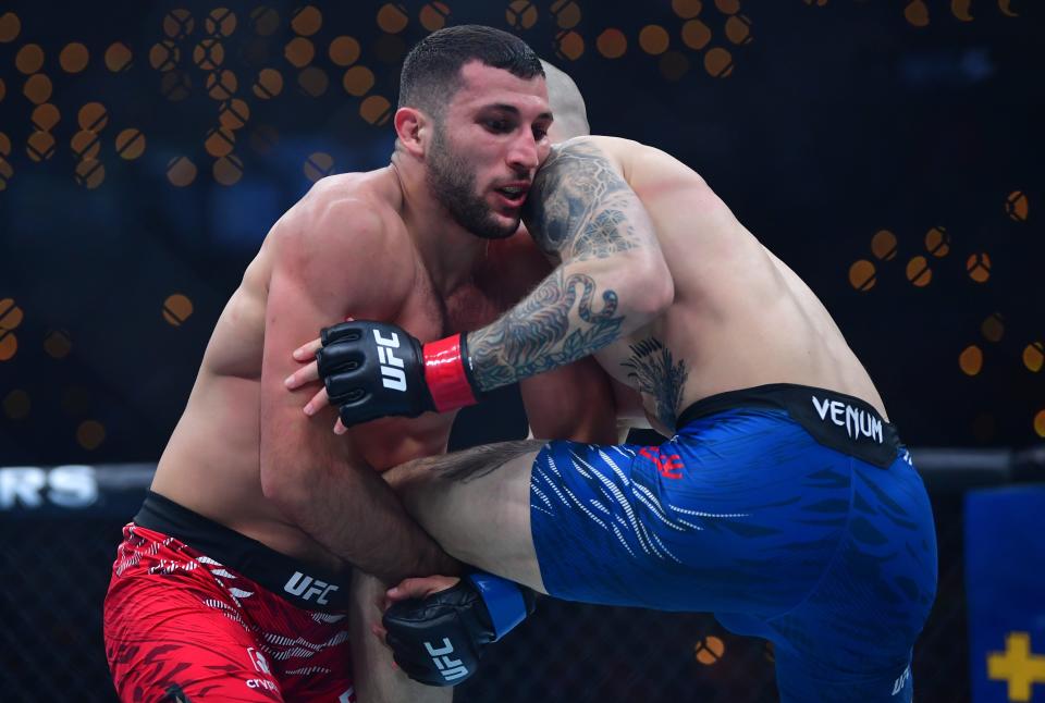 Jan 18, 2025; Inglewood, California, USA; Zachary Reese (red gloves) fights Azamat Bekoev (blue gloves) during UFC 311 at Intuit Dome. Mandatory Credit: Gary A. Vasquez-Imagn Images