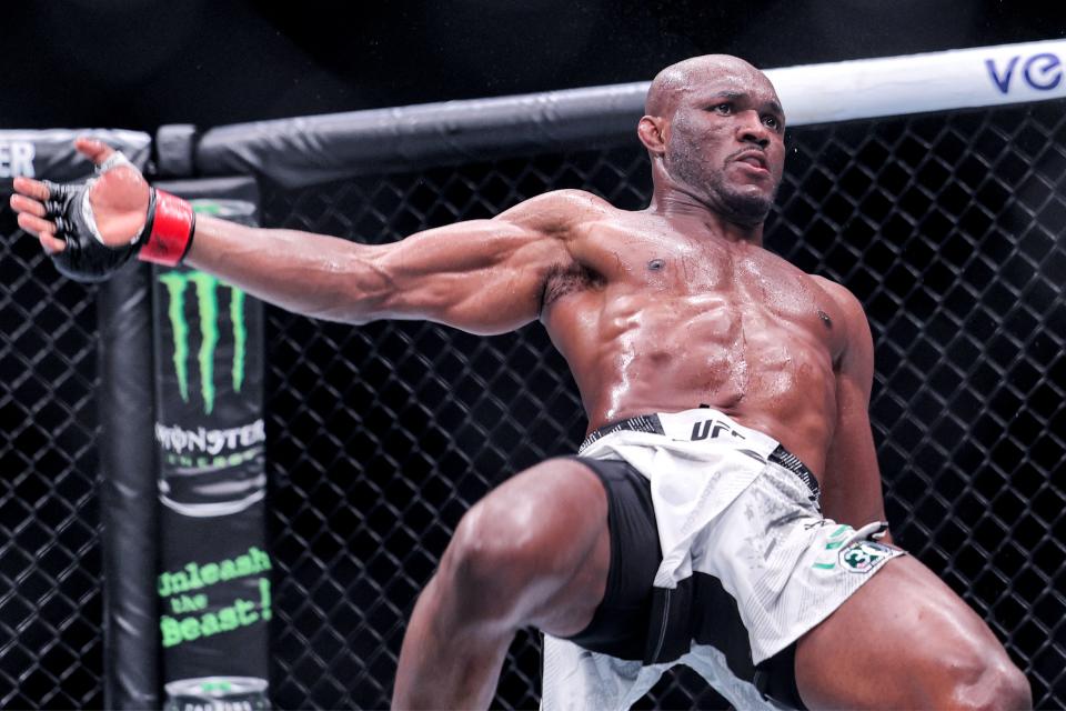 Nigeria's Kamaru Usman falls during his Middleweight bout against Russia's Khamzat Chimaev in the Ultimate Fighting Championship 294 (UFC) event at the Etihad Arena in Abu Dhabi on October 21, 2023. (Photo by Giuseppe CACACE / AFP) (Photo by GIUSEPPE CACACE/AFP via Getty Images)