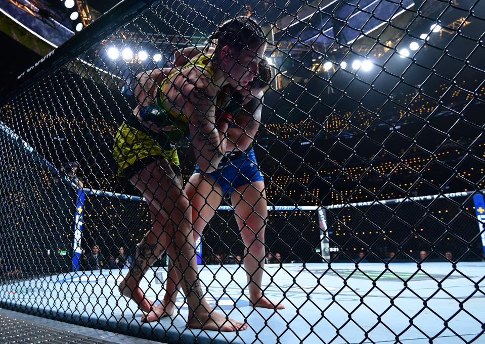 Jan 18, 2025; Inglewood, California, USA; Karol Rosa (red gloves) fights Ailin Perez (blue gloves) during UFC 311 at Intuit Dome. Mandatory Credit: Gary A. Vasquez-Imagn Images