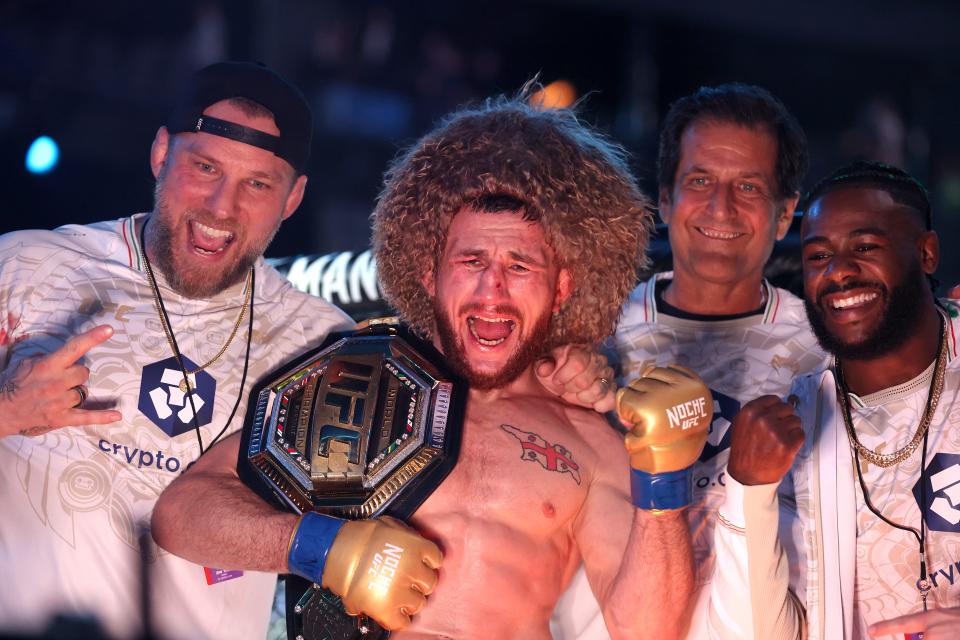 LAS VEGAS, NEVADA - SEPTEMBER 14: Merab Dvalishvili of Georgia poses with his team after defeating Sean O’Malley of the United States to win the bantamweight title during UFC 306: Riyadh Season Noche at Sphere on September 14, 2024 in Las Vegas, Nevada. (Photo by Christian Petersen/Getty Images)