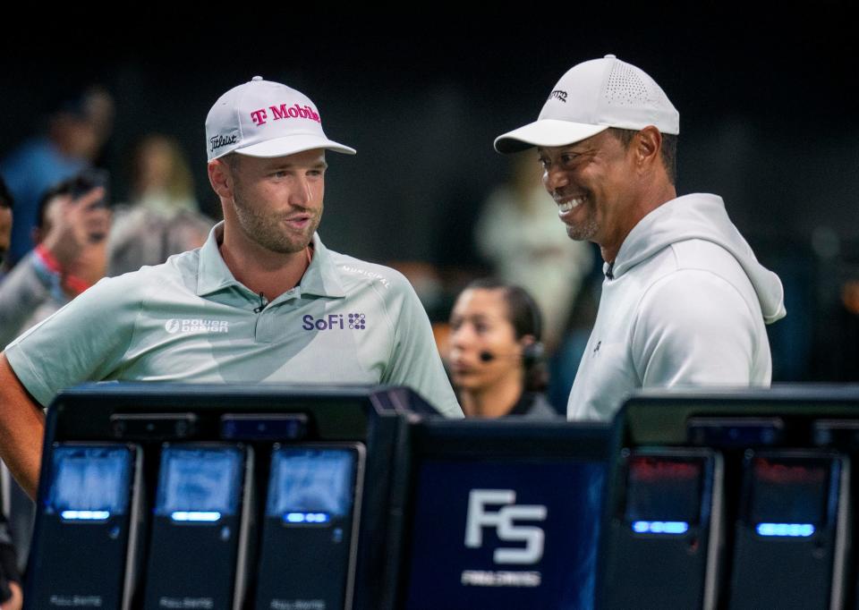 The Bay Club's Wyndham Clark and Tiger Woods talk before the match at SoFi Center, the home of TGL, the interactive golf league founded by Tiger Woods and Rory McIlroy on January 7, 2025 in Palm Beach Gardens, Florida.