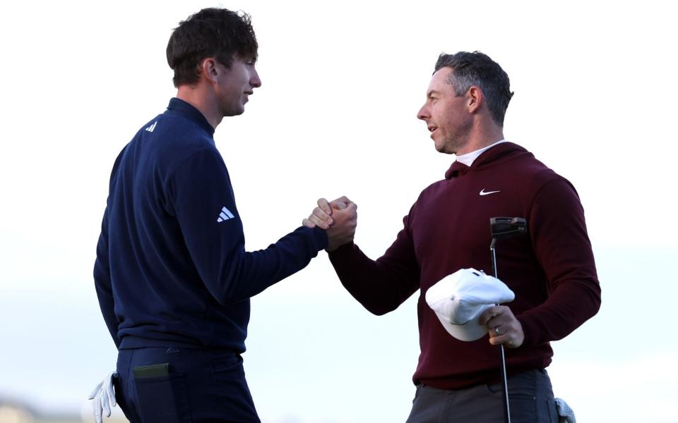 Tom McKibbin (left) with fellow Northern Irish golfer Rory McIlroy, 12 September 2024