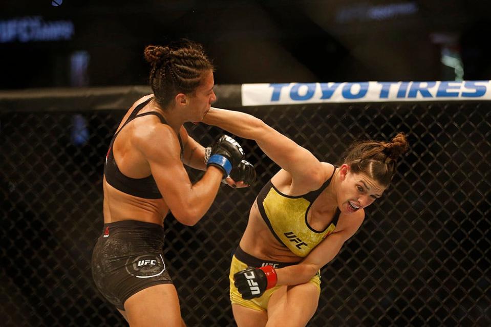 Oct 12, 2019; Tampa, FL, USA; Mackenzie Dern (red gloves) fights Amanda Ribas (blue glove) during UFC Fight Night at Amalie Arena. Mandatory Credit: Reinhold Matay-USA TODAY Sports