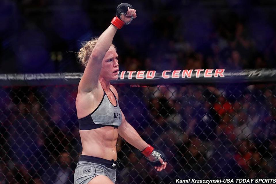 Jun 9, 2018; Chicago, IL, USA;  Holly Holm (red gloves) defeats Megan Anderson (blue gloves) during UFC 225 at United Center. Mandatory Credit: Kamil Krzaczynski-USA TODAY Sports