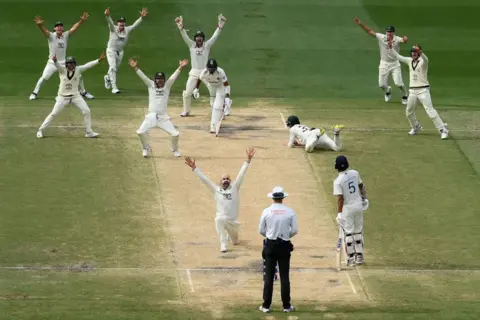 Getty Images Nathan Lyon celebrates after trapping Mohammed Siraj lbw as Australia won the match during day five of the Men's Fourth Test Match in the series between Australia and India at Melbourne Cricket Ground on December 30, 2024 in Melbourne, Australia.