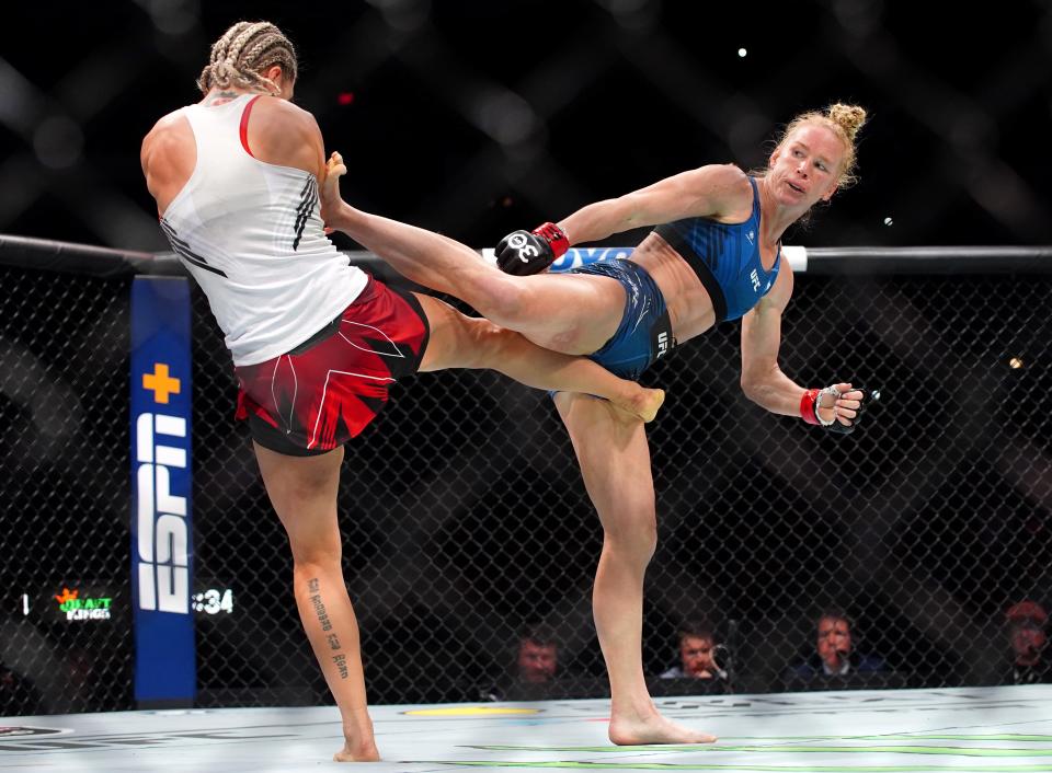 Mar 25, 2023; San Antonio, Texas, USA; Holly Holm (red gloves) fights Yana Santos (blue gloves) during UFC Fight Night at AT&T Center. Mandatory Credit: Aaron Meullion-USA TODAY Sports