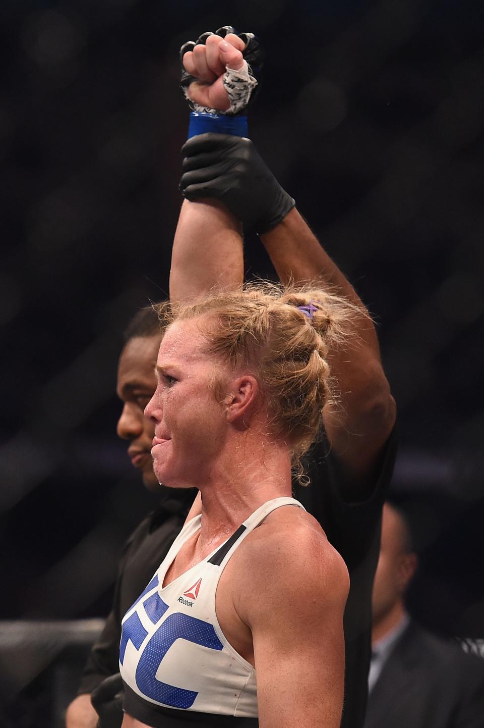 Nov 15, 2015; Melbourne, Australia; Holly Holm (blue gloves) celebrates after defeating Ronda Rousey (not pictured) during UFC 193 at Etihad Stadium. Mandatory Credit: Matt Roberts-USA TODAY Sports