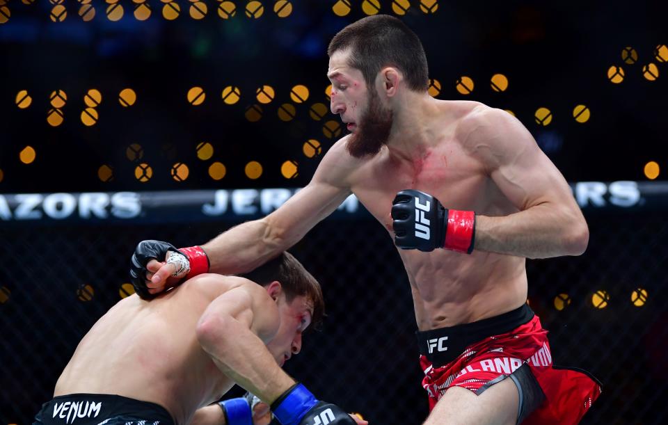 Jan 18, 2025; Inglewood, California, USA; Tagir Ulanbekov (red gloves) fights Clayton Carpenter (blue gloves) during UFC 311 at Intuit Dome. Mandatory Credit: Gary A. Vasquez-Imagn Images