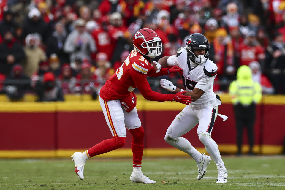 KANSAS CITY, MISSOURI - JANUARY 18: Jaylen Watson #35 of the Kansas City Chiefs covers Xavier Hutchinson #19 of the Houston Texans during the first half of the AFC Divisional playoff game at GEHA Field at Arrowhead Stadium on January 18, 2025 in Kansas City, Missouri. (Photo by Aaron M. Sprecher/Getty Images)