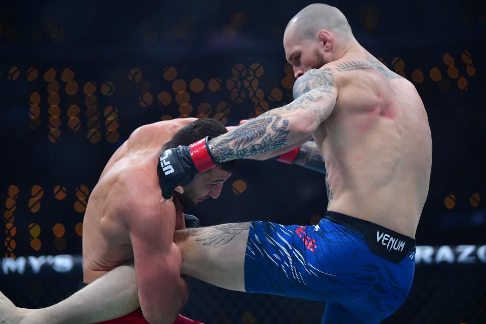 Jan 18, 2025; Inglewood, California, USA; Zachary Reese (red gloves) fights Azamat Bekoev (blue gloves) during UFC 311 at Intuit Dome. Mandatory Credit: Gary A. Vasquez-Imagn Images