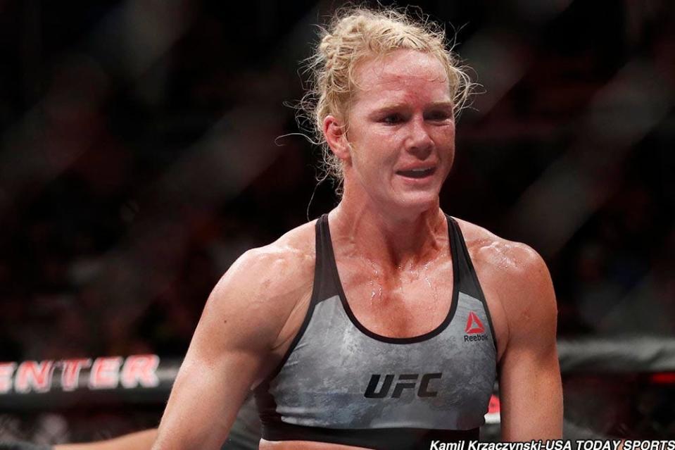 Jun 9, 2018; Chicago, IL, USA;  Holly Holm (red gloves) defeats Megan Anderson (blue gloves) during UFC 225 at United Center. Mandatory Credit: Kamil Krzaczynski-USA TODAY Sports