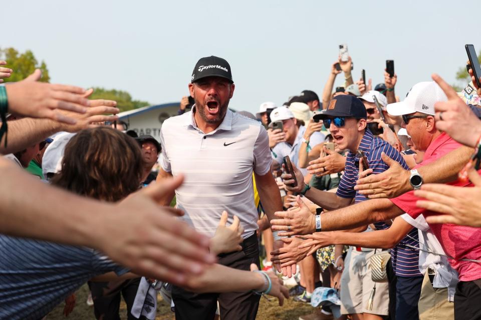 Michael Block of the Corebridge Financial PGA Team celebrates with spectators after hitting a hole-in-one on the 15th hole during the final round of the PGA Championship at Oak Hill Country Club on Sunday, May 21, 2023 in Rochester, New York. (Photo by Scott Taetsch/PGA of America via Getty Images)