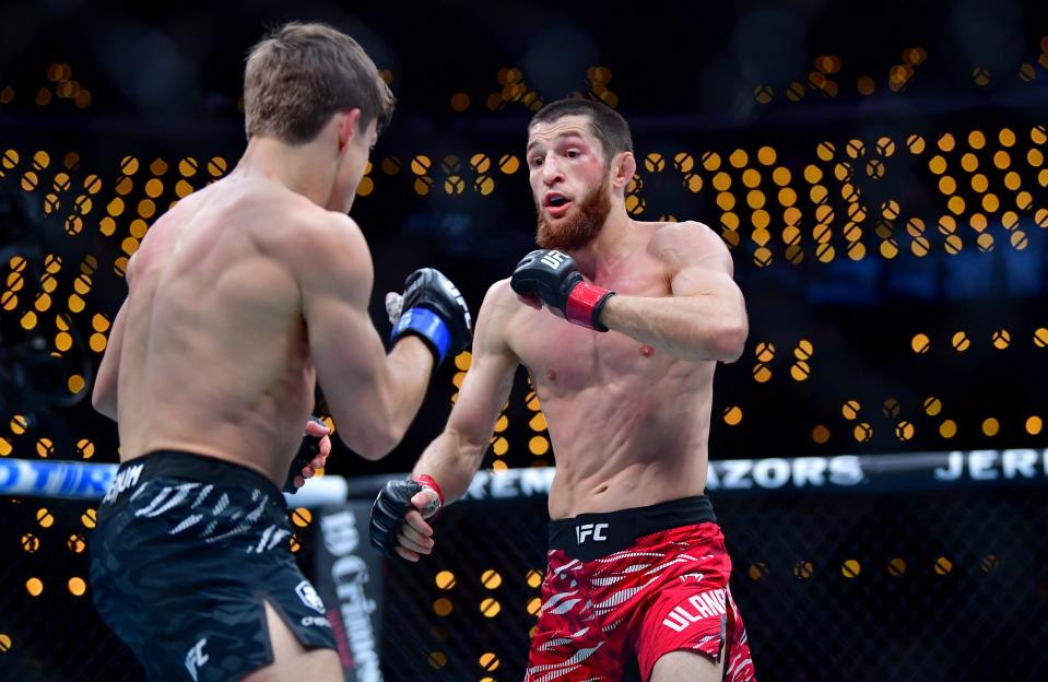 Jan 18, 2025; Inglewood, California, USA; Tagir Ulanbekov (red gloves) fights Clayton Carpenter (blue gloves) during UFC 311 at Intuit Dome. Mandatory Credit: Gary A. Vasquez-Imagn Images