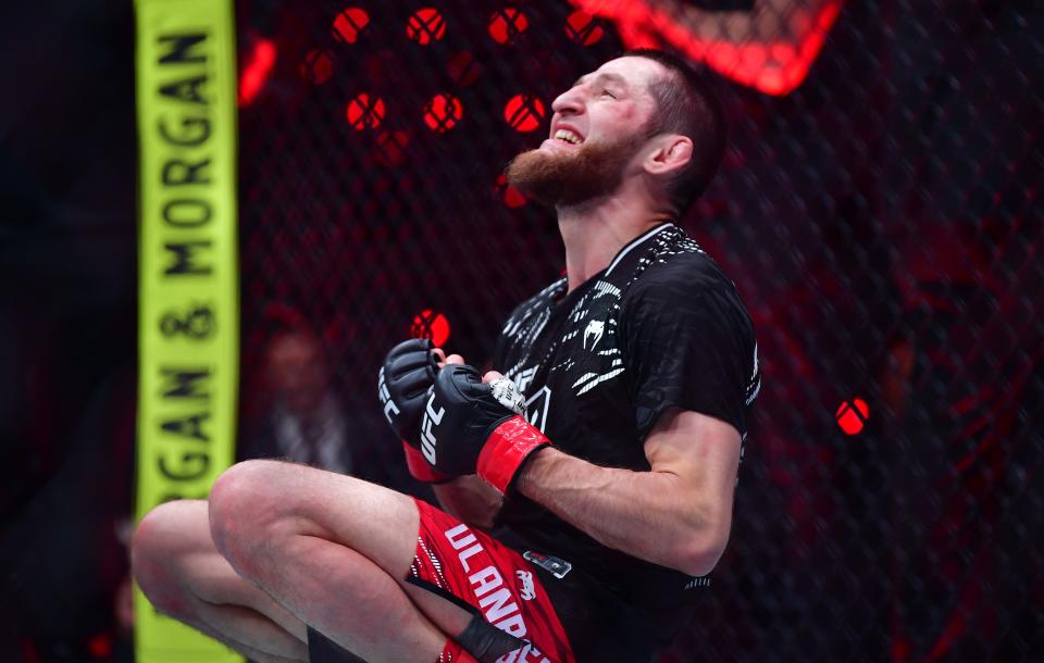 Jan 18, 2025; Inglewood, California, USA; Tagir Ulanbekov (red gloves) reacts after defeating Clayton Carpenter (not pictured) during UFC 311 at Intuit Dome. Mandatory Credit: Gary A. Vasquez-Imagn Images