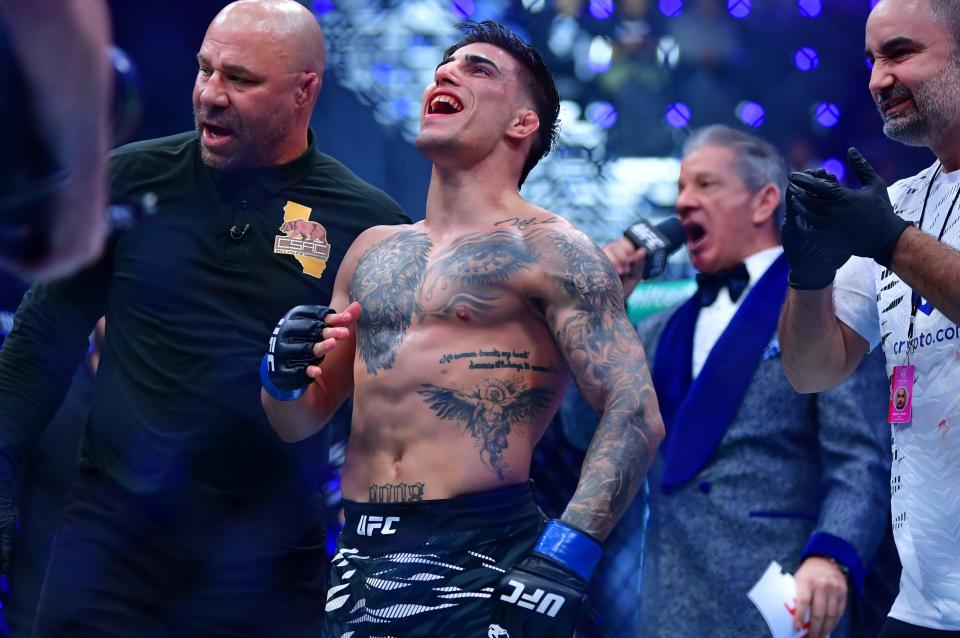 Jan 18, 2025; Inglewood, California, USA; Benardo Sopaj (blue gloves) reacts after defeating Ricky Turcios (red gloves) during UFC 311 at Intuit Dome. Mandatory Credit: Gary A. Vasquez-Imagn Images