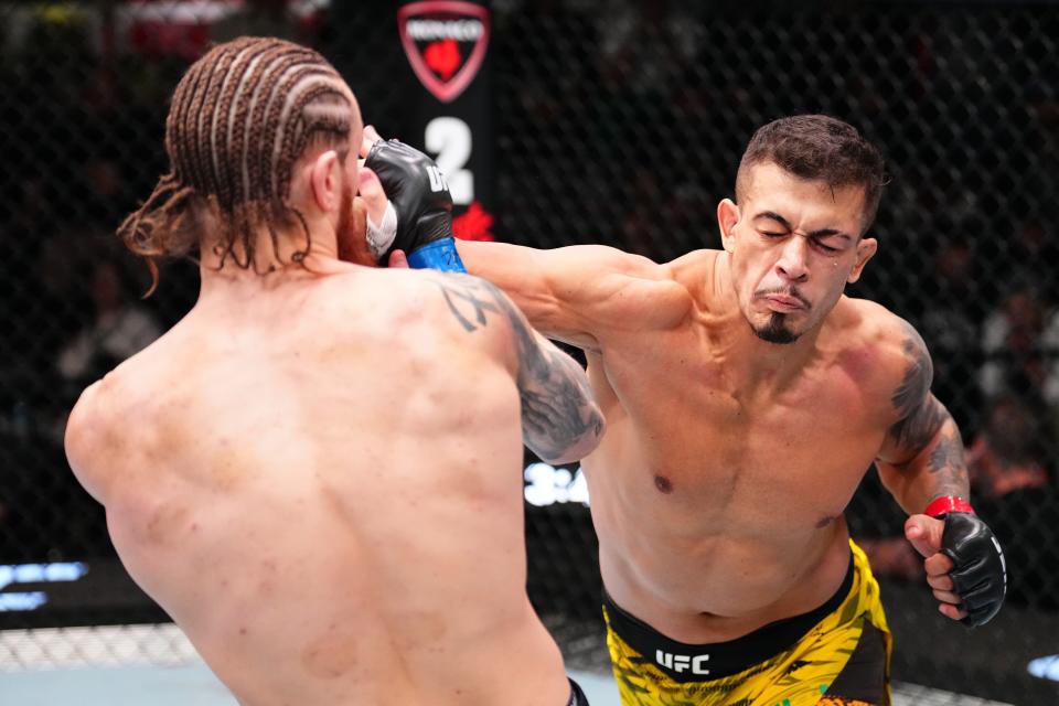 LAS VEGAS, NEVADA - JANUARY 11: (R-L) Marco Tulio of Brazil punches Ihor Potieria of Ukraine in a middleweight fight during the UFC Fight Night event at UFC APEX on January 11, 2025 in Las Vegas, Nevada. (Photo by Chris Unger/Zuffa LLC via Getty Images)