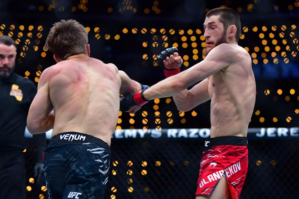 Jan 18, 2025; Inglewood, California, USA; Tagir Ulanbekov (red gloves) fights Clayton Carpenter (blue gloves) during UFC 311 at Intuit Dome. Mandatory Credit: Gary A. Vasquez-Imagn Images