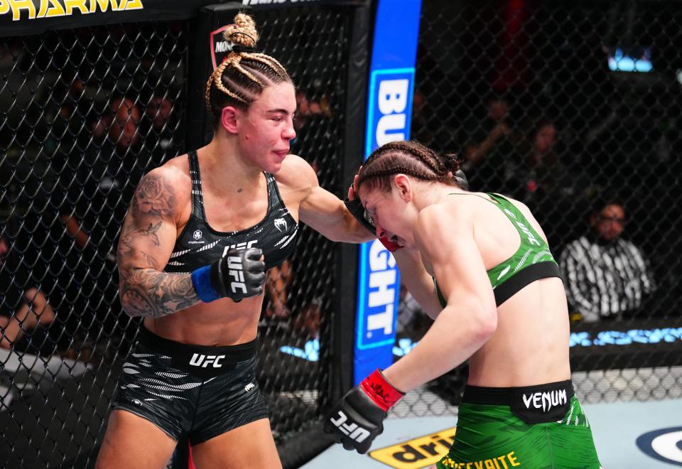 LAS VEGAS, NEVADA - JANUARY 11: (L-R) Nicolle Caliari of Brazil punches Ernesta Kareckaite of Lithuania in a flyweight fight during the UFC Fight Night event at UFC APEX on January 11, 2025 in Las Vegas, Nevada. (Photo by Chris Unger/Zuffa LLC via Getty Images)