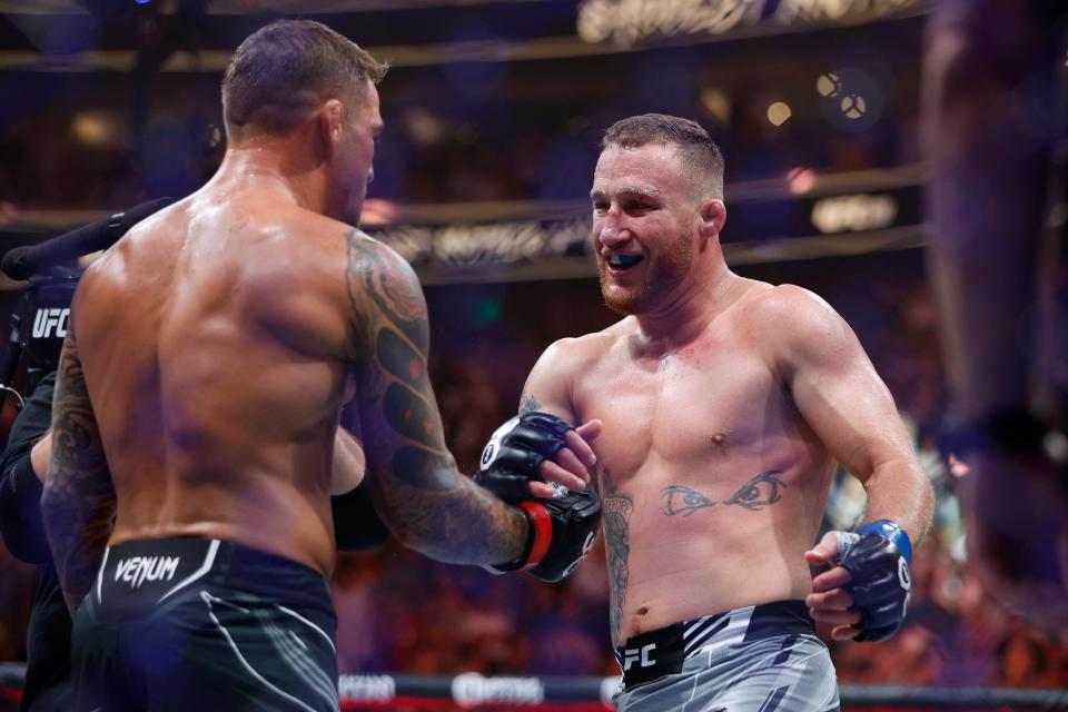 Jul 29, 2023; Salt Lake City, Utah, USA; Dustin Poirier (red gloves) shakes hands with Justin Gaethje (blue gloves) after their fight during UFC 291 at Delta Center. Mandatory Credit: Jeff Swinger-USA TODAY Sports