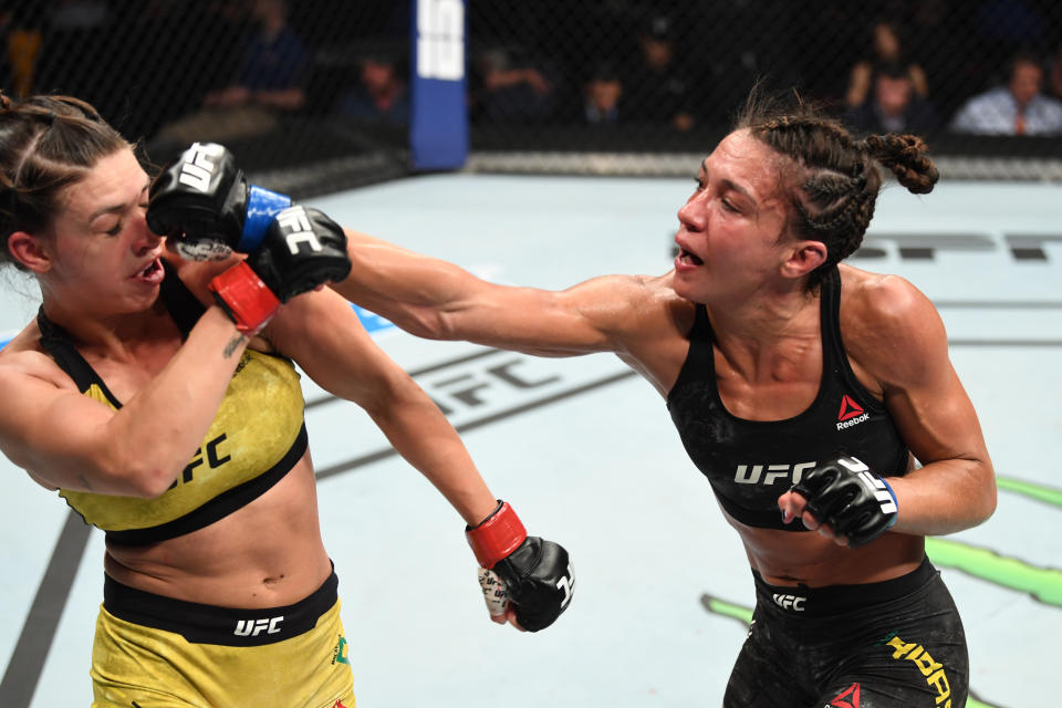 TAMPA, FLORIDA - OCTOBER 12: (R-L) Amanda Ribas of Brazil punches Mackenzie Dern  in their women's strawweight bout during the UFC Fight Night event at Amalie Arena on October 12, 2019 in Tampa, Florida. (Photo by Josh Hedges/Zuffa LLC via Getty Images)