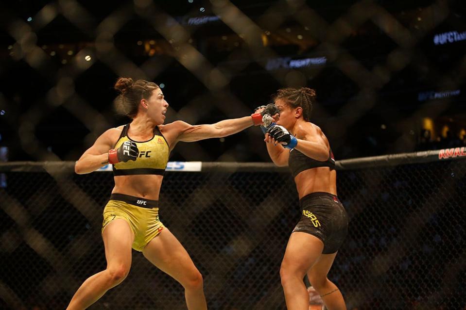 Oct 12, 2019; Tampa, FL, USA; Mackenzie Dern (red gloves) fights Amanda Ribas (blue glove) during UFC Fight Night at Amalie Arena. Mandatory Credit: Reinhold Matay-USA TODAY Sports