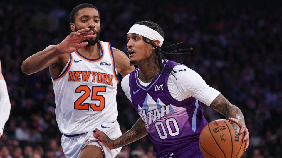 Jan 1, 2025; New York, New York, USA; Utah Jazz guard Jordan Clarkson (00) dribbles as New York Knicks forward Mikal Bridges (25) defends during the first half at Madison Square Garden.