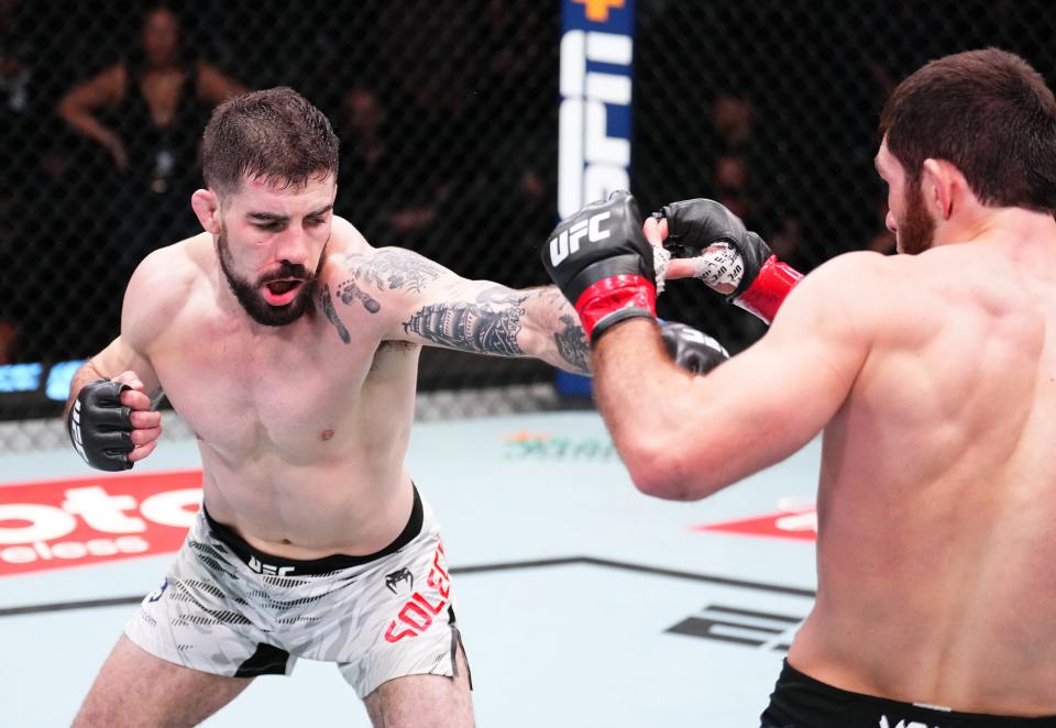 LAS VEGAS, NEVADA - JANUARY 11: (L-R) Joe Solecki punches Nurullo Aliev of Tajikistan in a lightweight fight during the UFC Fight Night event at UFC APEX on January 11, 2025 in Las Vegas, Nevada. (Photo by Chris Unger/Zuffa LLC via Getty Images)